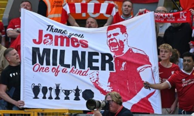 Liverpool fans display a banner for James Milner at the Premier League match against Aston Villa.