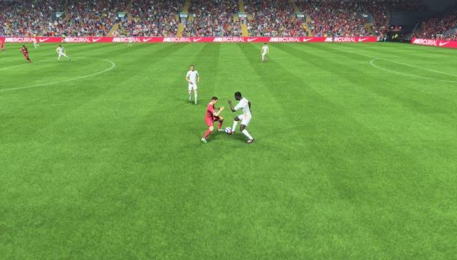 An LFC player tackles an opposing player after using Jockey to get close in EA Sports FC 24.