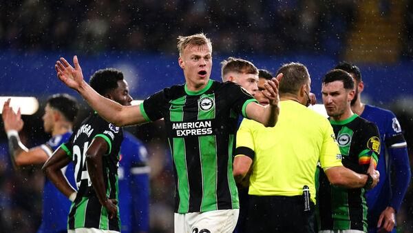 Ten-man Chelsea hang on as VAR denies Brighton